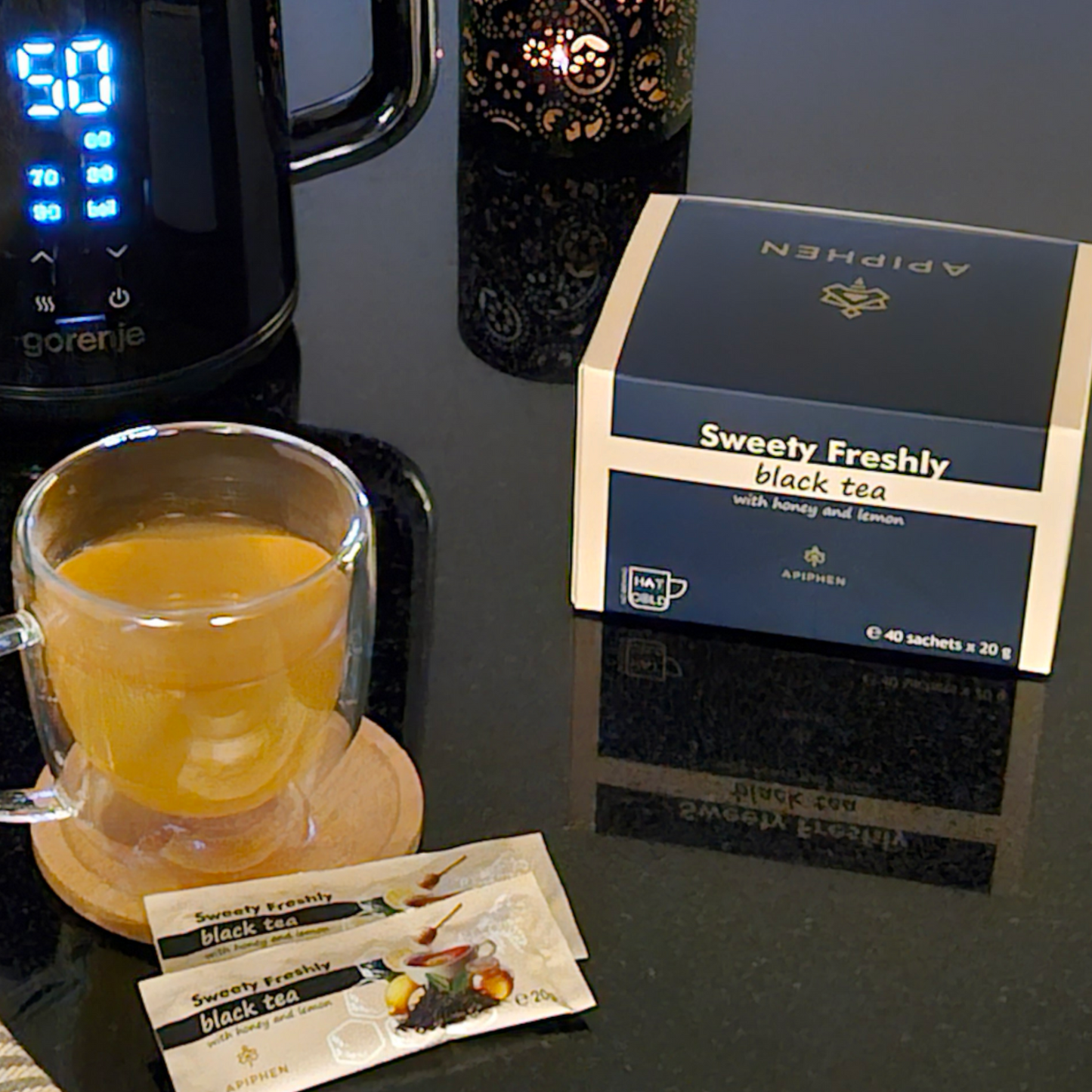 A cup of Sweety Freshly Black tea with honey and lemon ready to drink